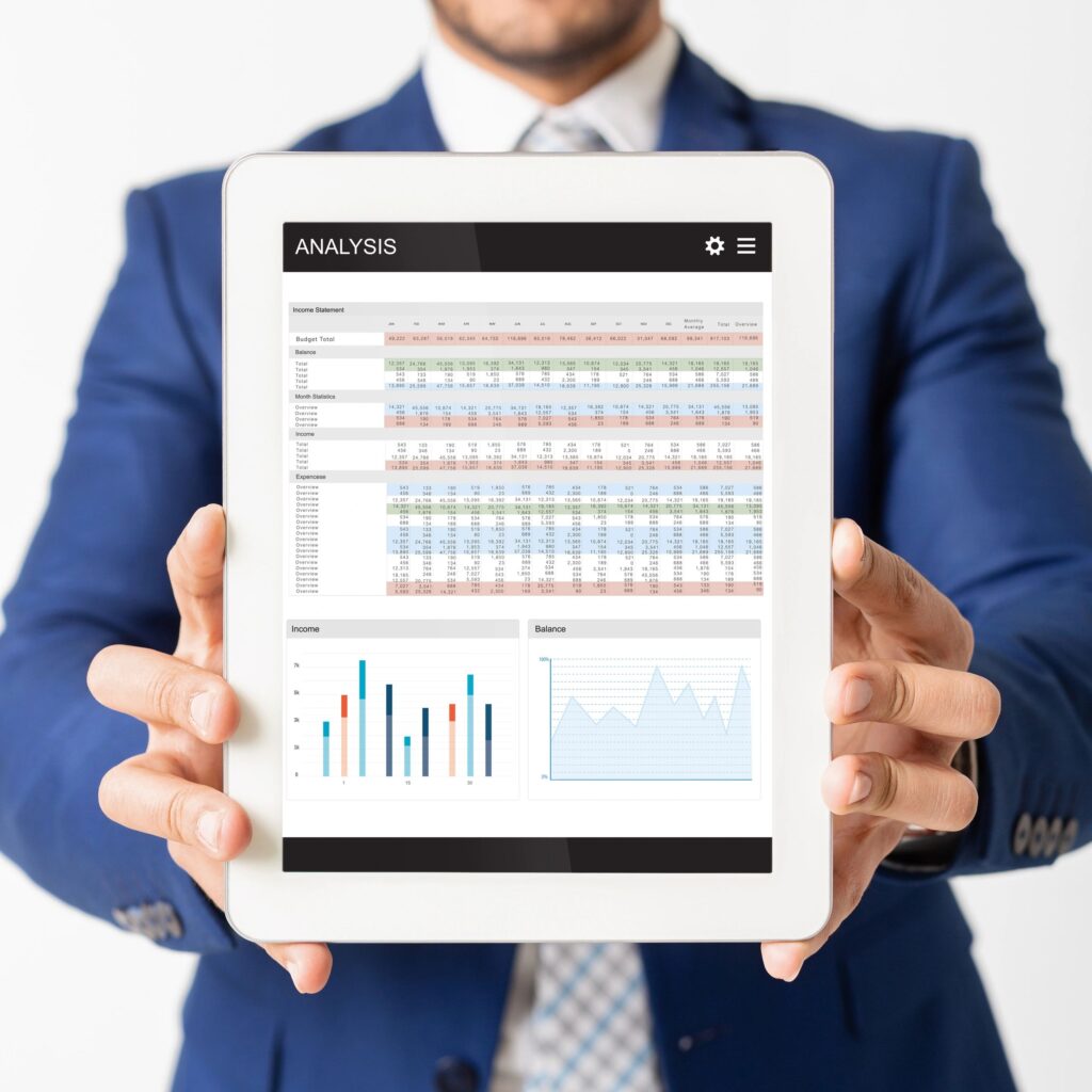 Digital tablet with analysis app on screen in businessman hands